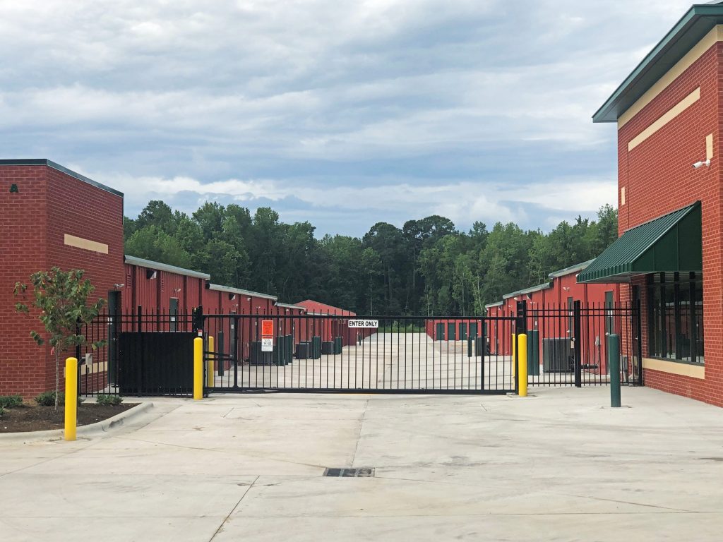 View of exterior of Ample Storage Rocky Mount facility security gate.