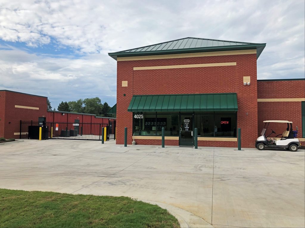 View of exterior of Ample Storage Rocky Mount facility security gate.